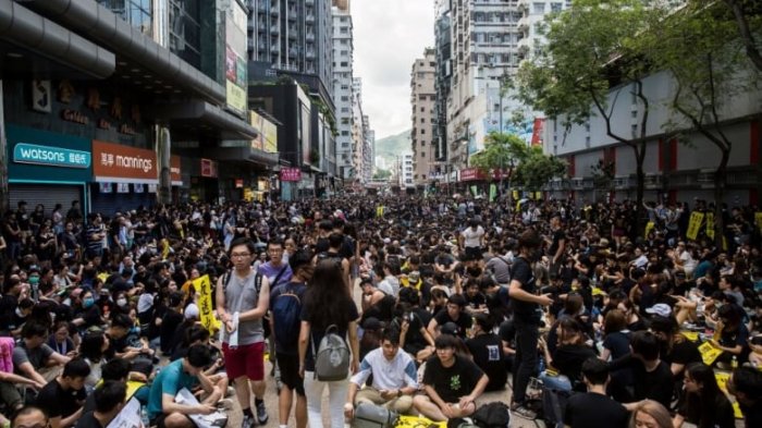   Hong Kong police fire tear gas as strikes paralyze city-  PHOTOS    