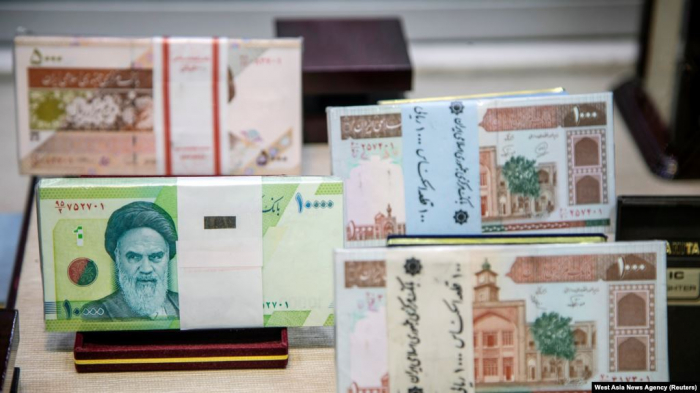 Iran moves to cut four zeroes from its struggling currency