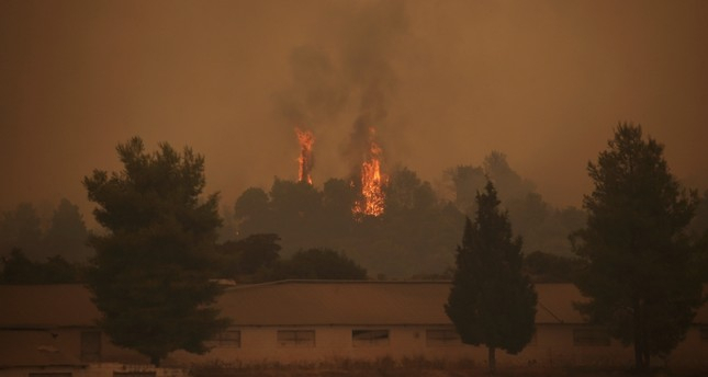 Wildfire rages on Greek island of Evia, smoke reaches Athens