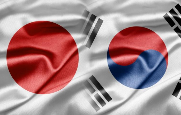 South Korea warns Japan of security pact risk, calls for 