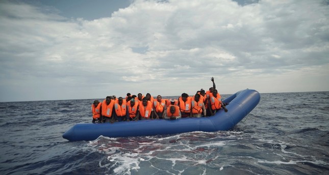 50 migrants saved from sinking boat off Libya