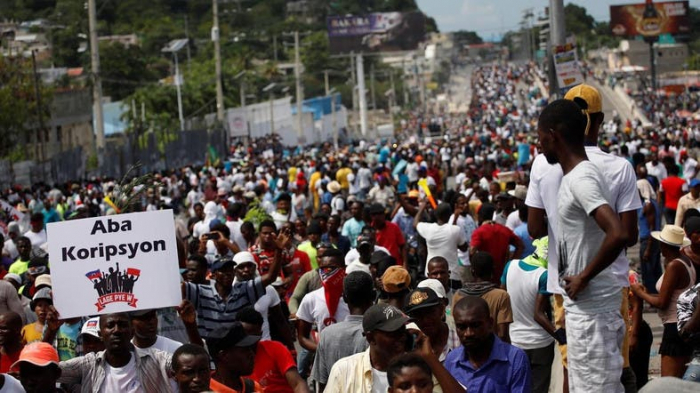 Thousands protest against Haiti
