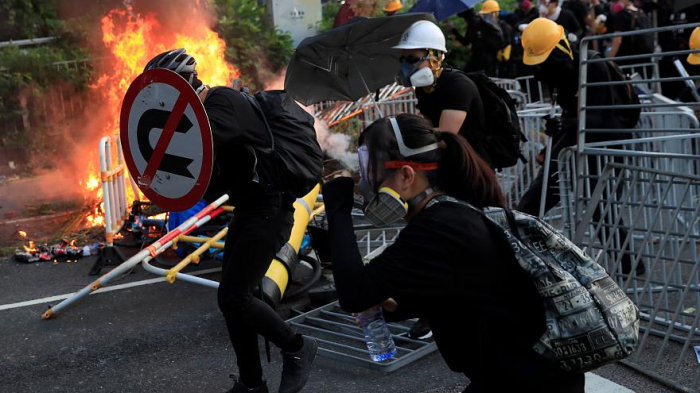   Hong Kong police break up protesters with force-  NO COMMENT    