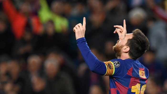 Messi toasts 700 games with a goal as Barca make last 16
 