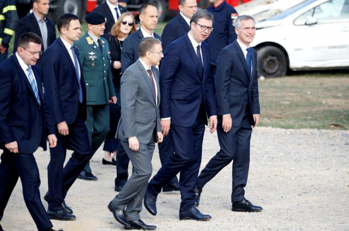 Ahead of NATO summit, Serbia buffeted between West and Russia  