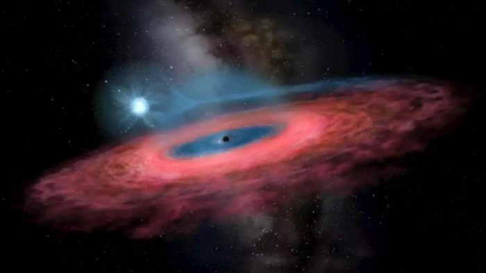 Astrónomos hallan el agujero negro más grande y cercano a Tierra