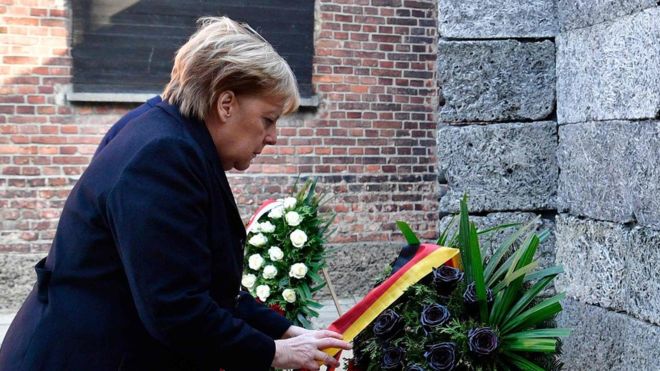 Auschwitz visit: Angela Merkel says past Nazi crimes part of German identity