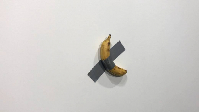  "Very tasty!": Watch moment artist eats $120,000 banana at Art Basel-  NO COMMENT  