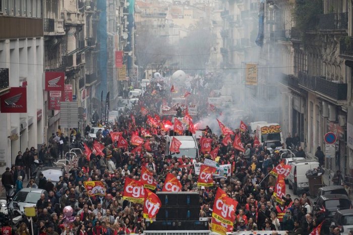 French strikers angry about pension reform cut power to homes, companies