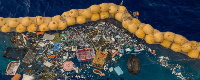 That ocean garbage collector is finally hauling in bags of plastic waste