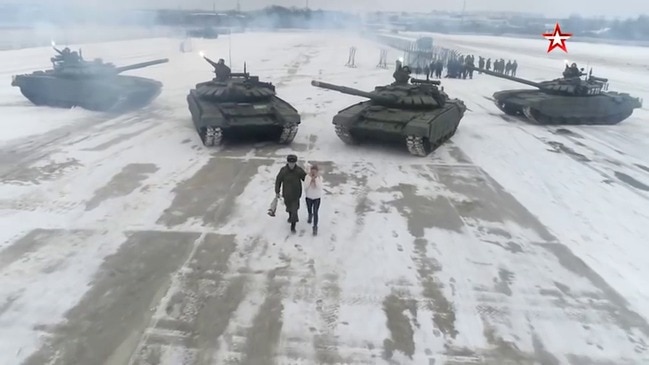   Tanks for the offer: Russian soldier proposes as armed vehicles make heart shape -   NO COMMENT    