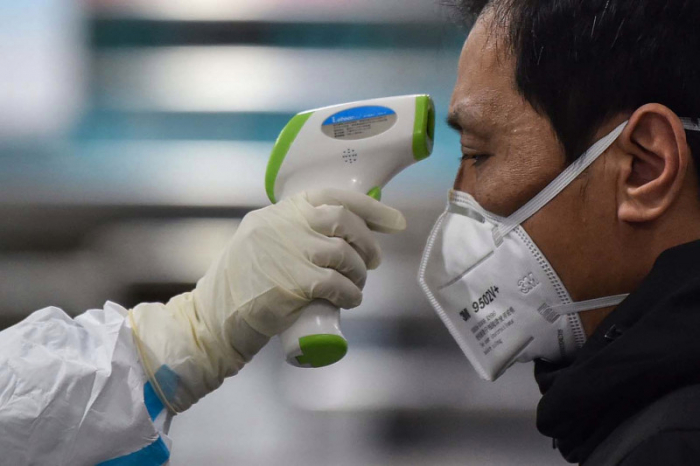Coronavirus infections slow in China as global economic impact spreads  