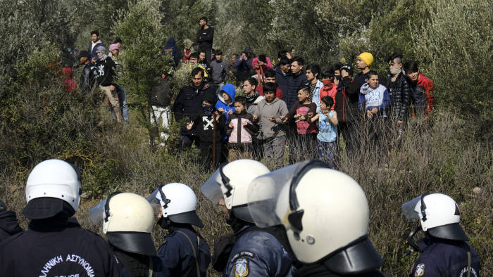 Greek guards fire tear gas as migrants mass on Turkish border