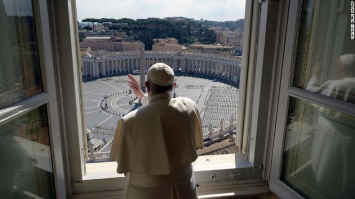 Pope Francis gives his blessing to an eerily empty St. Peter