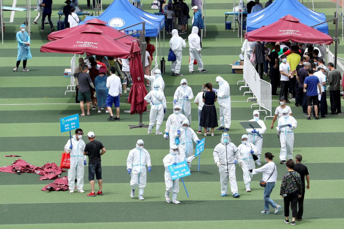 Crowds gather for coronavirus tests in Beijing amid new outbreak  
