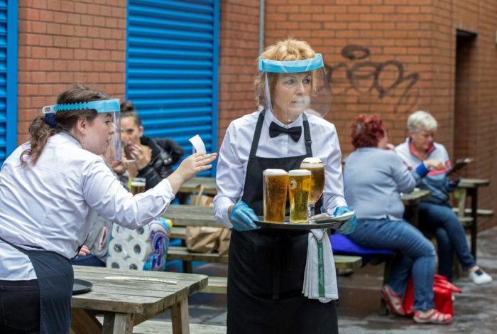 Pubs in England reopen despite lingering coronavirus fears
