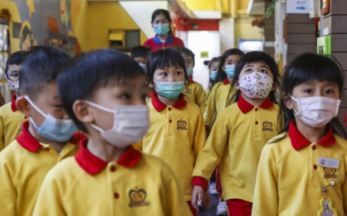Hong Kong to shut down schools amid virus spike