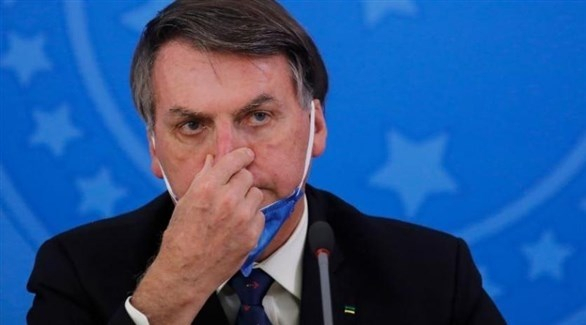 دعوى قضائية ضد رئيس البرازيل لتعريضه الصحافيين للخطر عند إعلان إصابته بكورونا