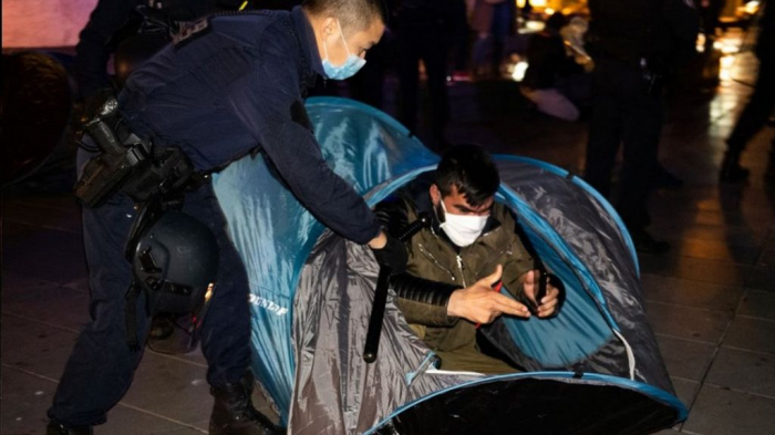 Paris police violently dismantle migrant camp