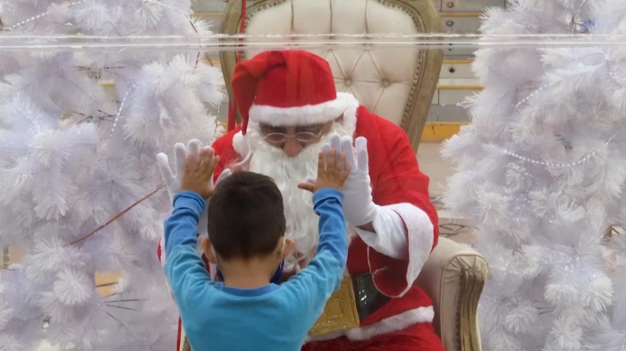  COVID restrictions: Santa meets children in Peru through a plastic bubble-  NO COMMENT  