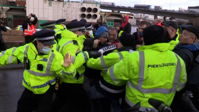 Stranded truck drivers clash with police at UK Stranded truck drivers clash with police at UK