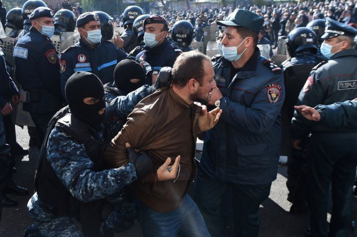   Armenian police begin to detain protesters outside parliament building  