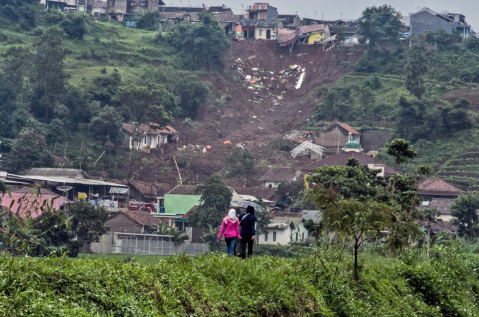 At least 13 dead, 26 missing as landslides hit Indonesia