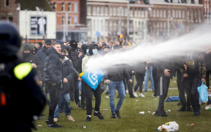 Dutch police detain over 240 people in anti-lockdown protests
