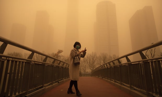 Beijing skies turn orange as sandstorm and pollution send readings off the scale