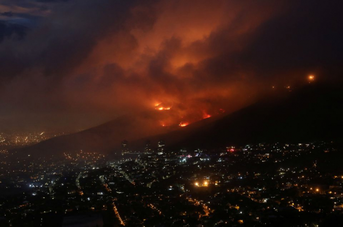 Firefighters fight to contain fire on S.Africa