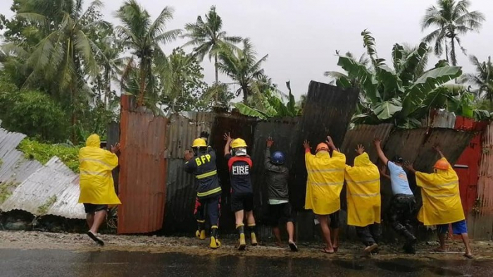 1 dead, 100,000 displaced as typhoon blows near Philippines
