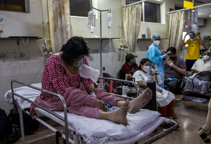 India’s COVID-19 daily cases hold close to record, another state imposes lockdown