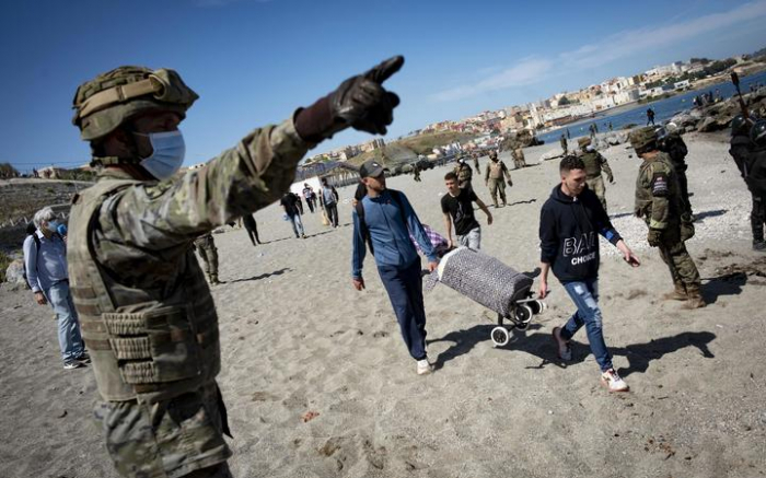 Spain sends troops as 8,000 migrants enter Ceuta 