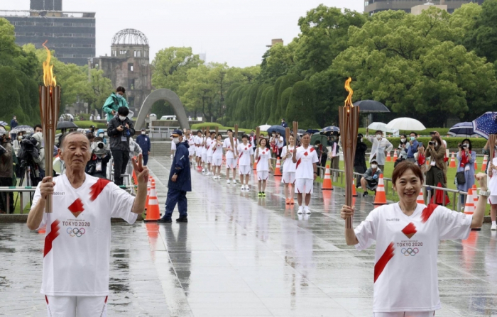 Downscaled Olympic torch relay held in Hiroshima amid COVID surge