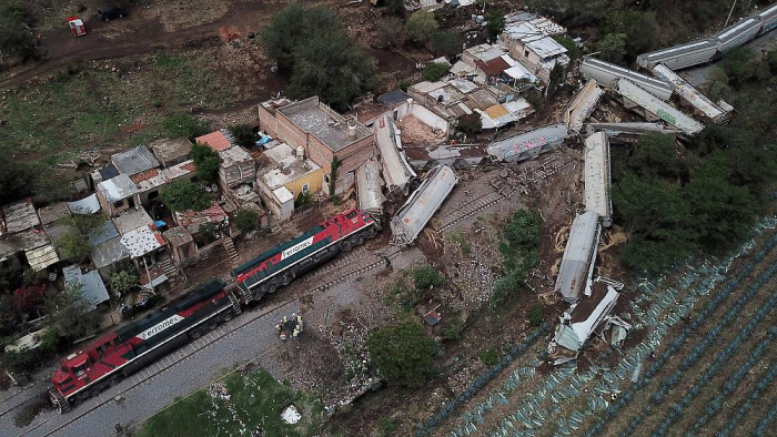  Derailed freight train that crushed homes and killed one person -   NO COMMENT    