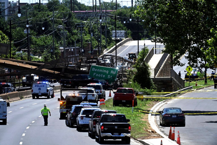 Pedestrian bridge collapses over DC highway, injuring 5