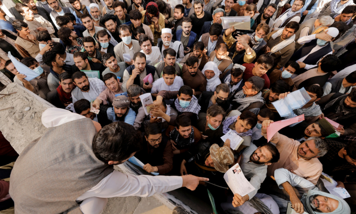 Afghans flock to passport office reopened by Taliban - NO COMMENT Afghans flock to passport office reopened by Taliban - NO COMMENT