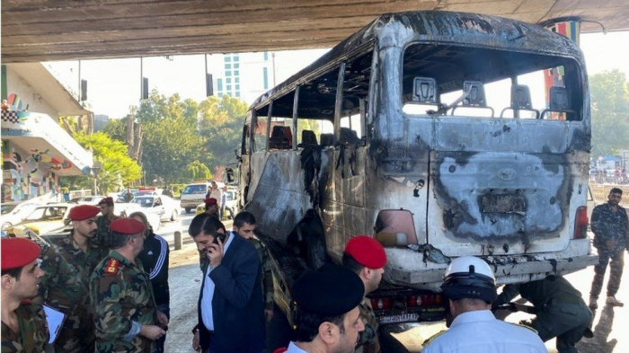 Syria war: Deadly bomb blasts hit military bus in Damascus