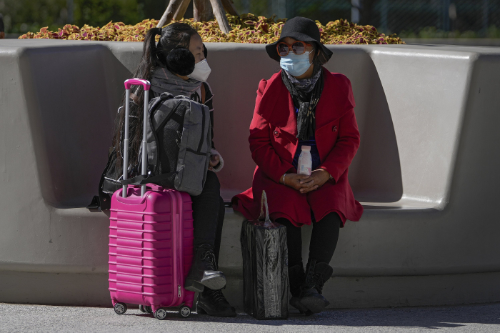 China bans flights, shut schools to stamp out new COVID-19 outbreak