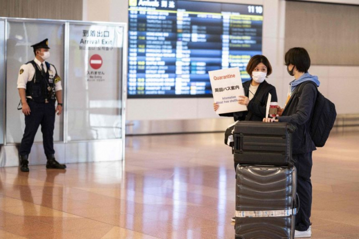 Japan to bar new foreign arrivals over virus variant