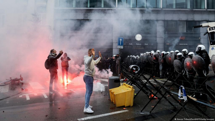 Police fire teargas and use water cannons to disperse protesters in Brussels