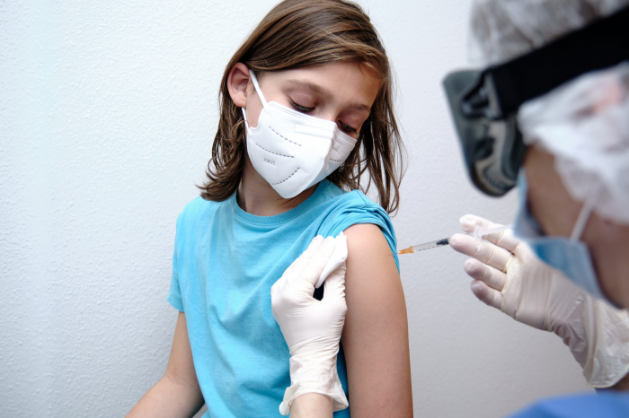 COVID-19 vaccine mandates for kids should be last resort - WHO 