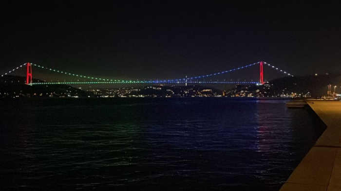   Fatih Sultan Mehmet Bridge in Istanbul illuminated in colors of Azerbaijani flag  