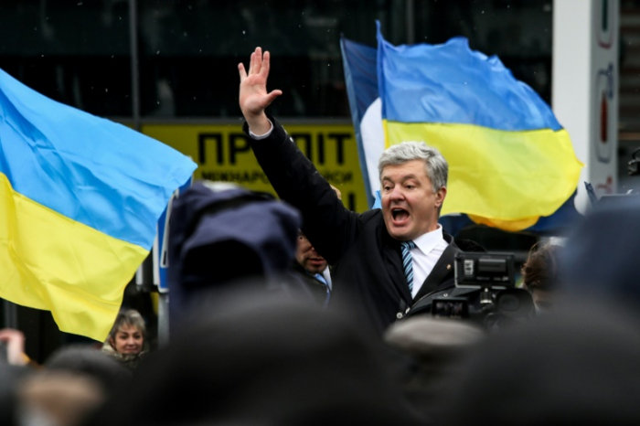   Facing arrest, ex-leader Poroshenko returns to 