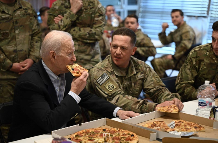   Biden eats pizza with US troops in Poland -   NO COMMENT    