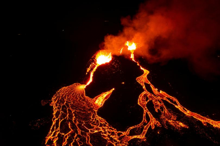   Red lava spews from Iceland volcano eruption at night -   NO COMMENT    