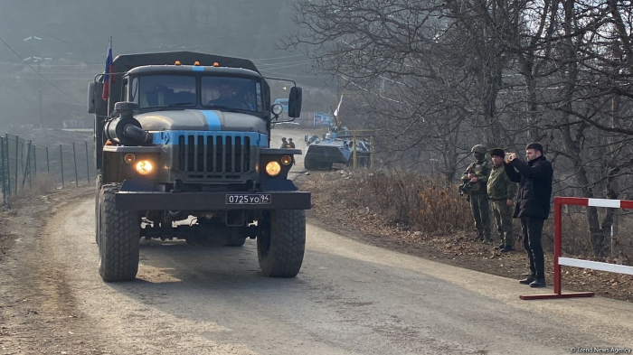 Vehicles of Russian peacekeepers continue passing along Azerbaijan