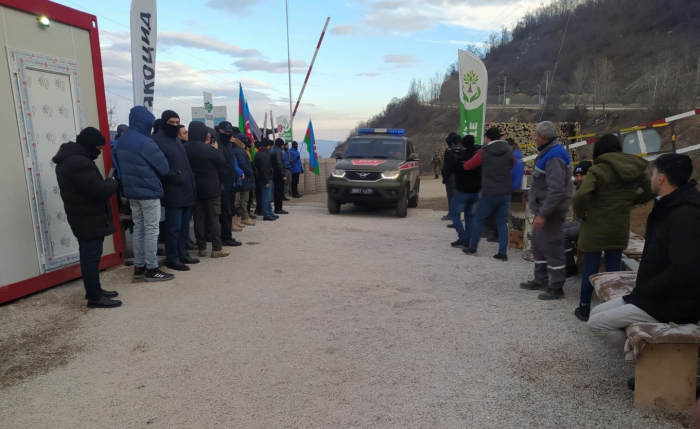   Several more vehicles of Russian peacekeepers pass freely along Lachin road   