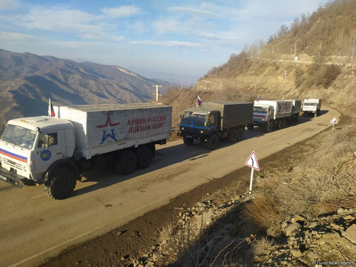   Several trucks of Russian peacekeepers pass freely along Lachin road   