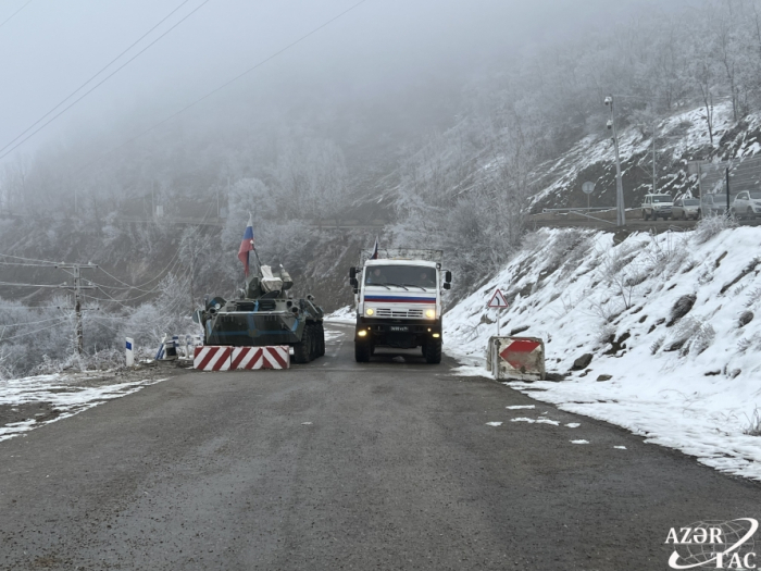   Two vehicles belonging to Russian peacekeepers pass freely through Lachin-Khankandi road  